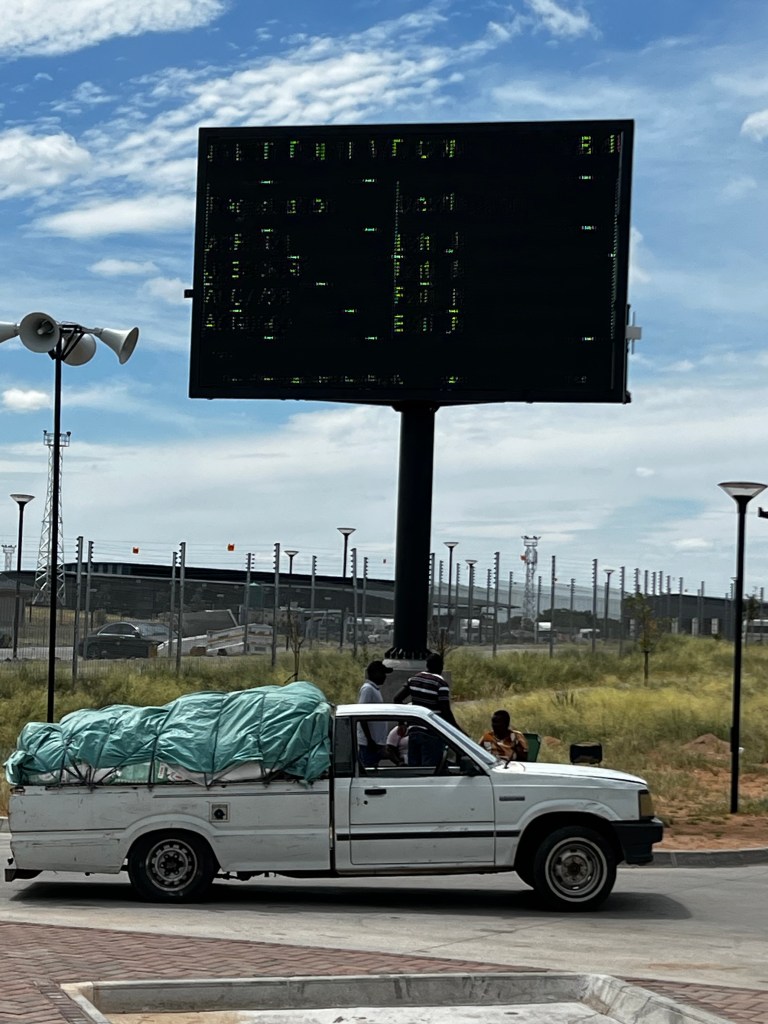 Typical Zm trader bakkie load. Pity the cell camera can't read the electronic display